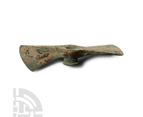 2nd-1st millennium B.C. With central shaft hole and blade set at a right angle. Cf. Christie's, The Axel Guttmann Collection 