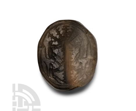 1st millennium BC. With conical upper face, underside with border enclosing an incuse palm tree with monkeys climbing up the 