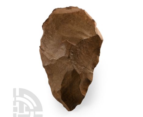 Lower Palaeolithic Period, circa 400,000-200,000 B.P. Ovate cleaver with large patch of cortex to one face. Cf. MacGregor, A.