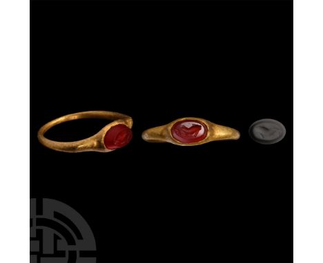 2nd-3rd century A.D. Carnelian gemstone with intaglio dolphin motif; supplied with a museum-quality impression.  4.14 grams, 