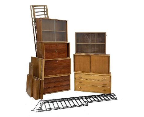 A collection of teak wall-mounted cabinets,two part sets, the first comprising:a walnut-fronted chest of three drawers, 76cm 