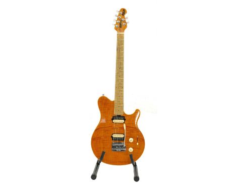 A 2008 Music Man Axis Super Sport electric guitar,of typical 'double-cutaway' form, in a translucent gold finish, complete wi