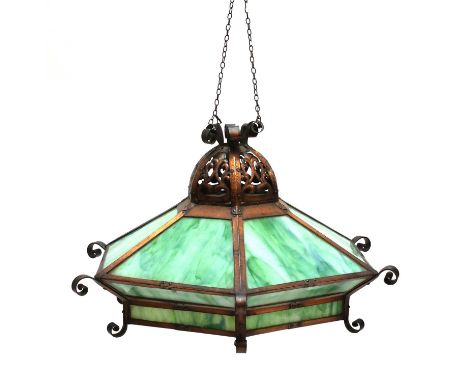 An American Arts and Crafts copper ceiling light,c.1910, of hexagonal form, topped by a dome with perforated scrolling decora