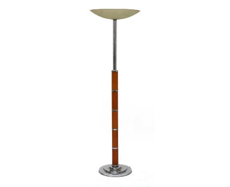 An Art Deco chrome and Bakelite standard lamp,  with a frosted dished shade, with a reeded column, on a stepped chrome plinth