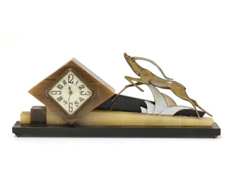 An Art Deco marble and onyx mantel clock, the lozenge-shaped dial with Arabic numerals and inscribed ‘DEP’, surmounted with a