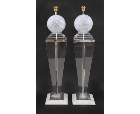 A pair of Lucite lamps,French, designed by Jean Claude Mahey for Maville Interiors, each mounted with a globe, mounted on a t