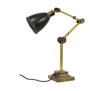 A Dugdills machinist’s lamp,raised on a loaded plinth, with a green enamelled shade, 60cm approximatelyCondition report: Work