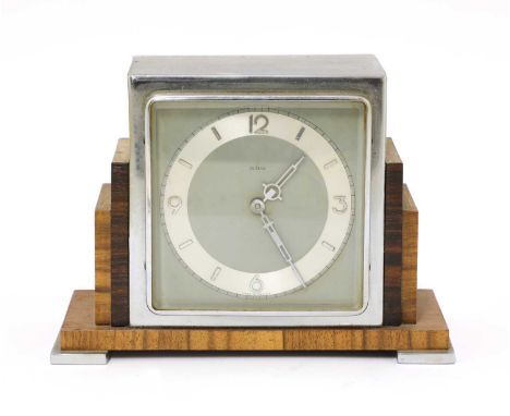 An Art Deco walnut and rosewood mantel clock,  with a chrome chapter ring, with an eight-day movement,  17.7cm wide 7.7cm dee