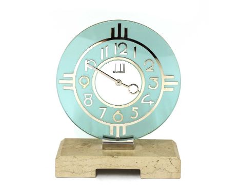 A Dunhill mantel clock, in the Art Deco style, with a green-tinted circular dial, a silvered face marked ‘Dunhill’, on a marb