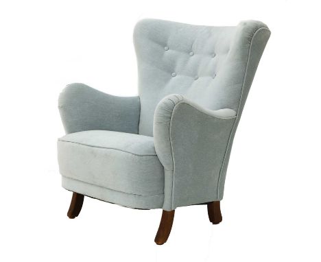 A light blue upholstered armchair,Danish, with a button back and beech frame and supports, 75cm wide85cm deep90cm high, seat 