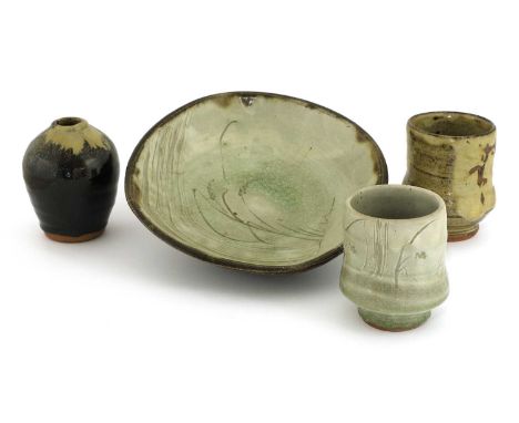 *Mike Dodd (b.1943),two stoneware yunomi, both of waisted form, one in a khaki glaze, the other in a grey and celadon glaze w