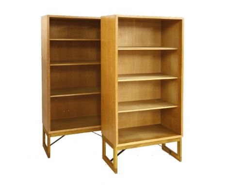 A pair of light oak open bookcases, designed by Børge Mogensen for Karl Andersson & Söner, each with three adjustable shelves