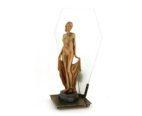 An Art Deco spelter table lamp,mounted with a nude, in a copper finish, with a lozenge glass panel,42cm high