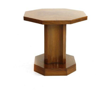 An Art Deco walnut lamp table,with an octagonal top, on a shaped cruciform column,60cm diameter55.5cm high