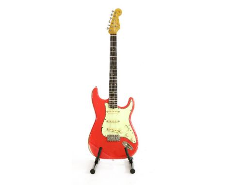 A Fender Stratocaster '61 style electric guitar,the relic finish in fiesta red by Dominic Henderson echoing the legendary Str