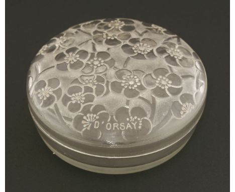 A Lalique moulded glass powder pot and cover,moulded with flowers and 'D'ORSAY', and moulded 'R. Lalique', 10cm diameter