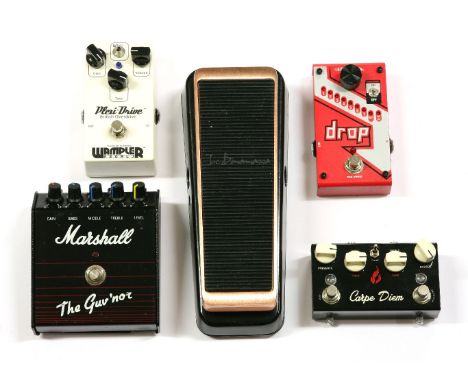 A group of five guitar effects pedals,comprising: a Marshall 'The Guv'nor',a Wampler Pedals 'Plexi-Drive British Overdrive',a