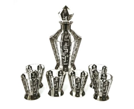An Art Deco black enamel glass liqueur set, comprising a decanter,25cm high, andsix beakers,8cm high (7)