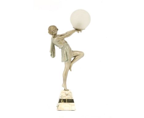 An Art Deco spelter and marble table lamp,the silvered figure holding aloft a glass globe,9cm diameter47cm high