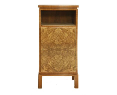 An Art Deco walnut cabinet, with a shelf over a cupboard,51cm wide36cm deep111cm high