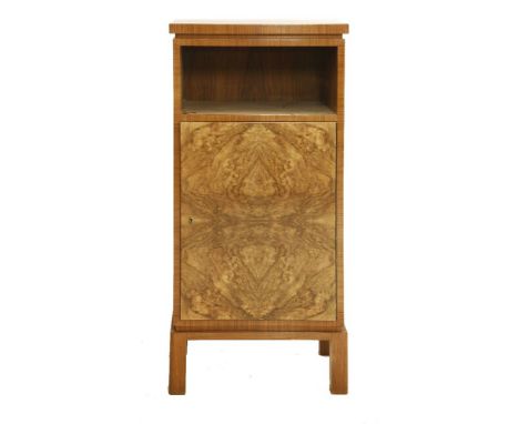 An Art Deco walnut cabinet, with a shelf over a cupboard,51cm wide36cm deep111cm high