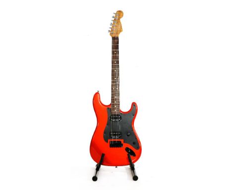 A luthier built Fender Stratocaster style electric guitar,the metallic orange body fitted with Charvel SoCal electrics includ