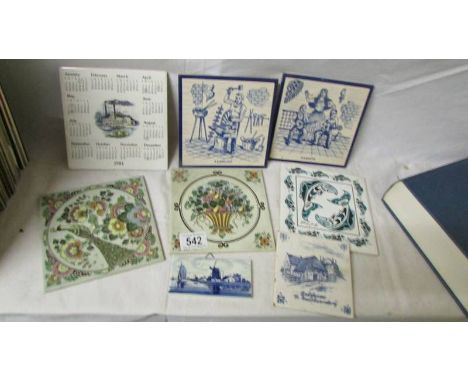 Eight old ceramic tiles.