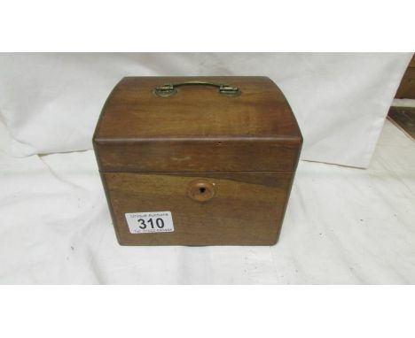 An Edwardian mahogany tea caddy.