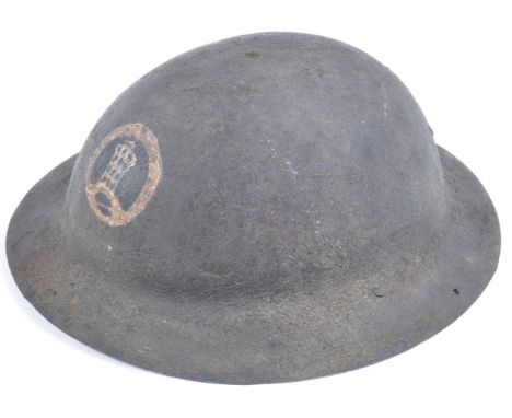 An original WWI First World War British Army ' Tommy ' steel combat Brodie helmet. The helmet lacking liner or chin strap, bu
