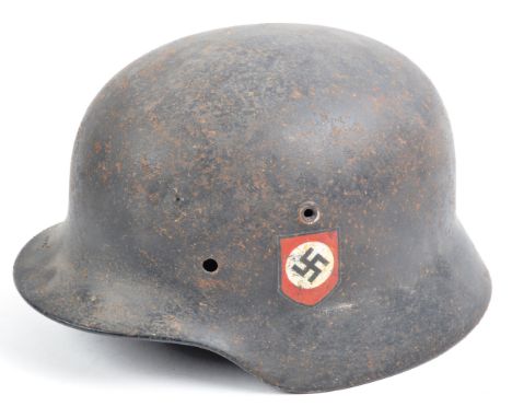 An original WWII Second World War Third Reich Nazi German Army stahlhelm M40 steel uniform combat helmet. Later painted to re