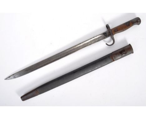 An original WWI First World War era 1907 pattern Lee Enfield sword bayonet. The bayonet having a hooked steel pommel with pus