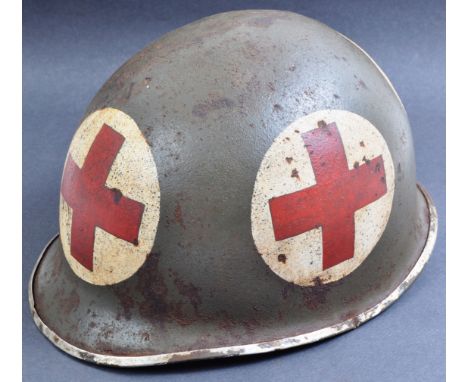 An original WWII Second World War US United States Army M1 fixed bale Medics helmet.&nbsp;Steel outer shell with fixed bale (