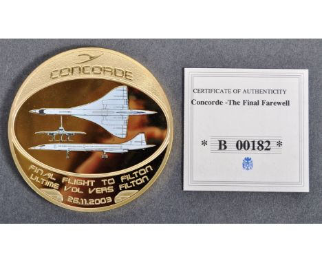 A Limited Edition Concorde aircraft Final Flight commemorative medal / medallion with certificate. The gold plated medallion 