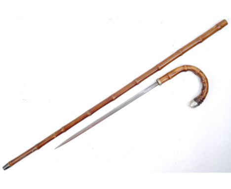 An early 20th Century middle eastern gentleman's sword stick / walking cane with concealed blade. The cane having a hooked ha