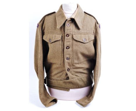 An original WWII Second World War era 1940 pattern Royal Artillery battle dress uniform blouse. The blouse by Mourne Clothing