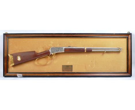 A Franklin Mint made John Wayne 1892 model .44-40 non-firing Winchester replica rifle.&nbsp;The rifle having a walnut-stained