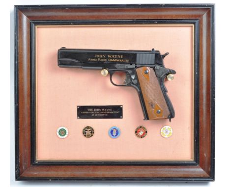 A Franklin Mint made John Wayne US American Armed Forces Commemorative non-firing .45 automatic handgun / pistol replica. The