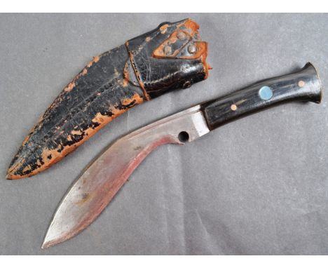 An original WWII Second World War period Nepalese Gurkha Kukri knife of small proportions. The horn handle engraved ' Calcutt