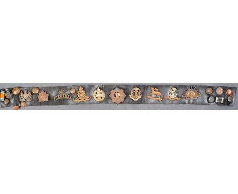 An original WWI First World War British Army soldier's souvenir cap badges and belt. The belt featuring over twenty original 