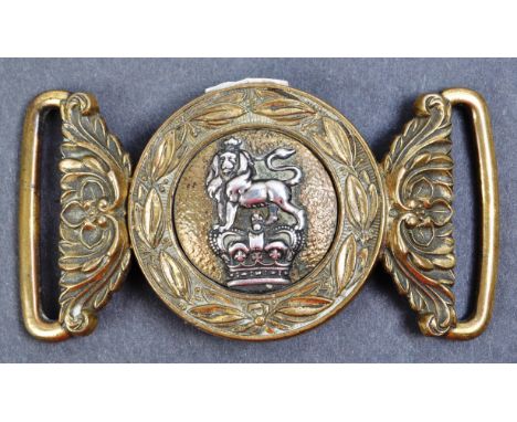 A 19th Century Victorian British Army issue officers uniform belt buckle. The interlocking brass buckle depicting to the cent