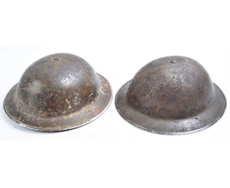 Two original WWII Second World War British Army / Civil Defence steel Brodie helmets. Both complete with original liners and 