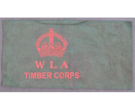A WWII Second World War WLA Women's Land Army Timber Corps (WTC) cloth armband. Dark green construction with red printed W L 