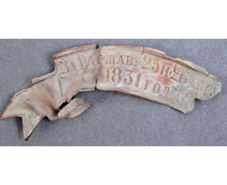 A 19th Century Polish Russian War / November Uprising battlefield relic badge / plaque. The metal ribbon shaped item with Rus