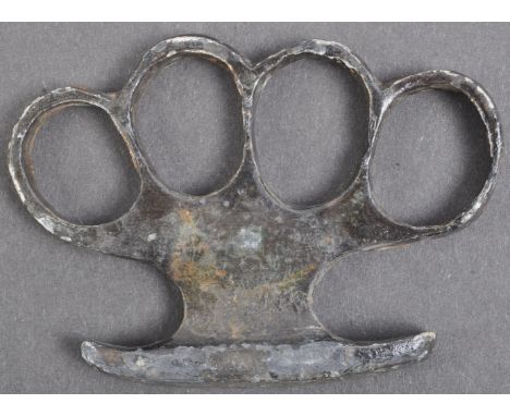 An original WWI First World War believed British Army knuckle duster / brass knuckles. Typical form, likely steel constructio