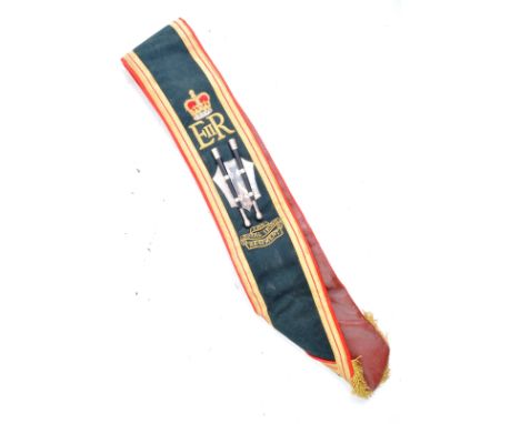 A 20th Century Royal Irish Regiment military drum belt sash. The sash of red leather construction&nbsp;faced with black cloth