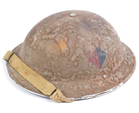 An original WWII Second World War 1940 dated British Army steel combat Brodie helmet. The helmet with impressed maker's marks