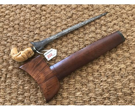 An antique Malayan kris dagger, having characteristic carved ivory stylized bird-form handle and pronounced pamor to the blad