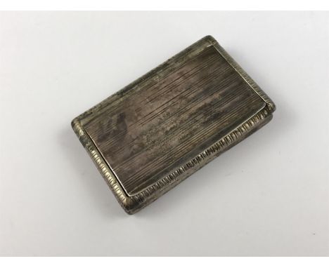 An early 19th Century French silver snuff box, having banded decoration, with standard mark / poincon for the period 1819-183