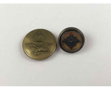 A Second World War RAF escape and evasion button compass