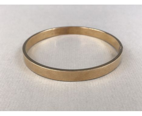 A vintage yellow-metal bangle, stamped 9ct, tests as gold, 13.5g